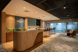 Sesaya Poshtel lounge bar area with wood counter and pendant lighting
